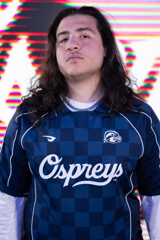 Aidan Fork wearing a UNF Esports jersey for Fighting Games