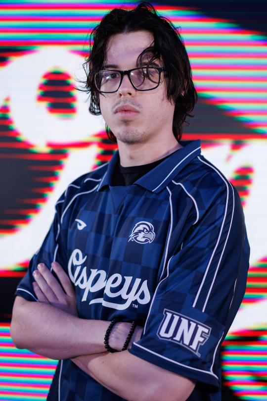 Christian Caron in a UNF Esports jersey for Varsity Fighting Games
