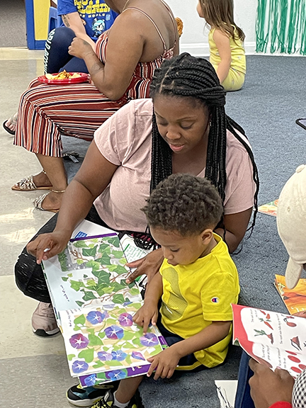 Mother reading to kid.