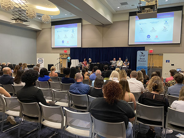 overview of a group of people at a conference