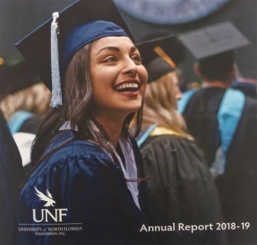Cover of the 18-19 annual report with graduate in cap and gown looking up