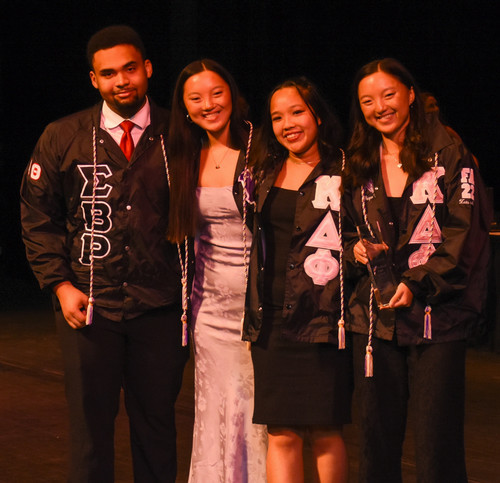 2024 mgc exec. 4 students posing for a photo after being given an award