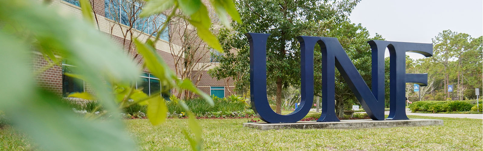 UNF logo statue in the grass