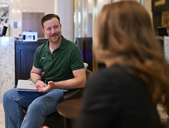 Two people chatting while sitting