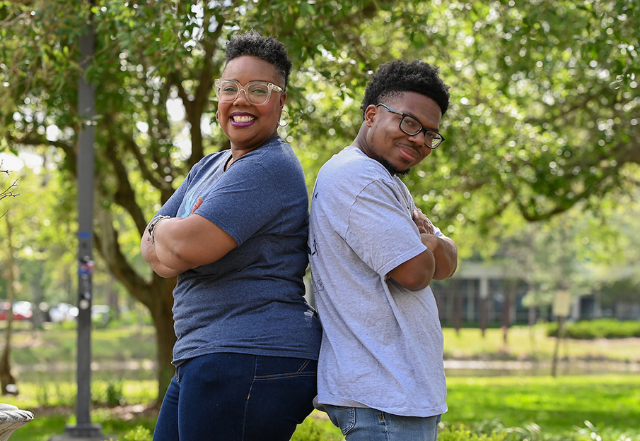 Janelle and Julian Hooks posing back-to-back