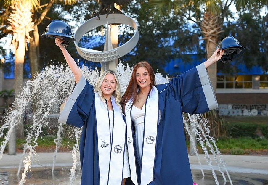 Graduates celebrate at Osprey Fountain