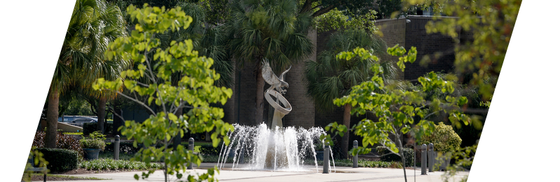 UNF Osprey Fountain Statue surrounded by greenery 