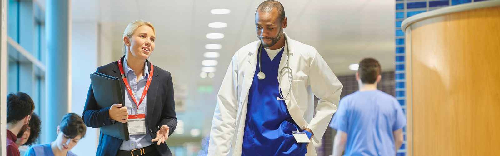 hospital administrator with senior hospital doctor