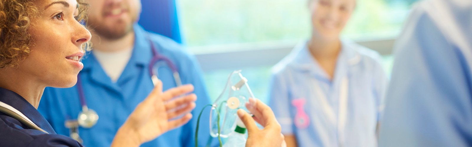 Nurse holding an oxygen mask