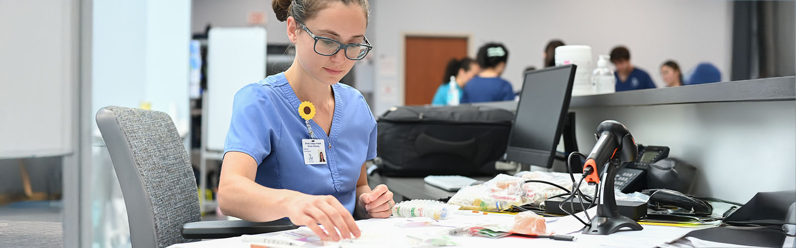nursing student at a desk