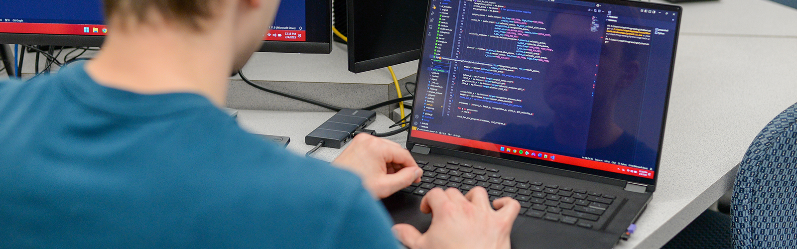 student working on a laptop