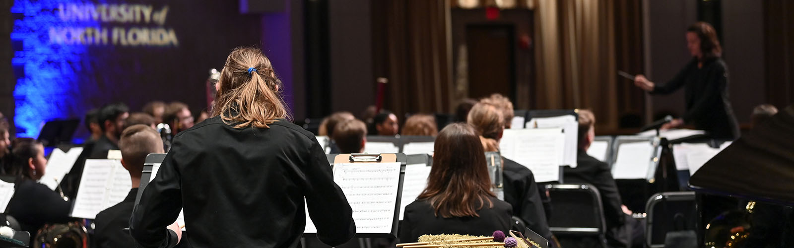orchestra practicing on stage