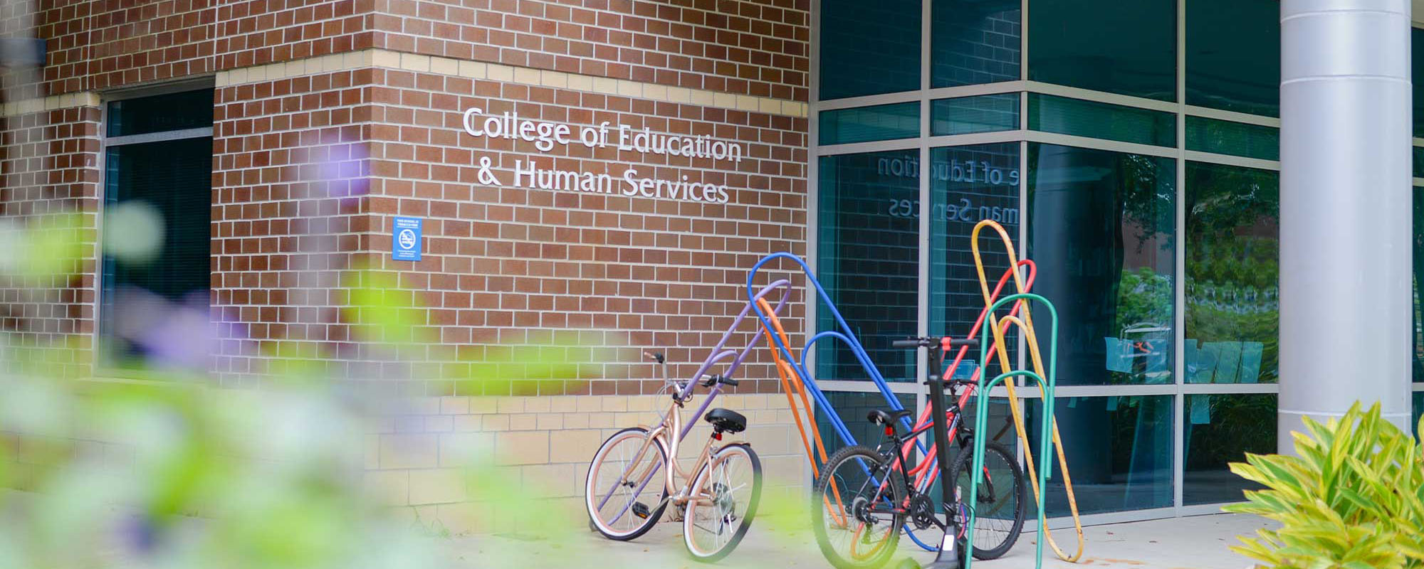 College of Education building with bikes parked in front of it