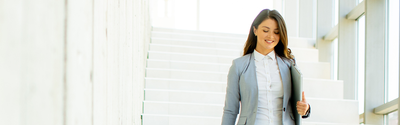 an administrator walking down a staircase