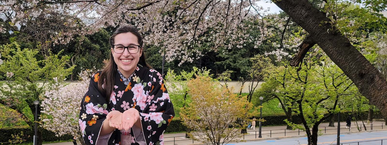 Darryn Bone in black floral Japanese kimono smiling