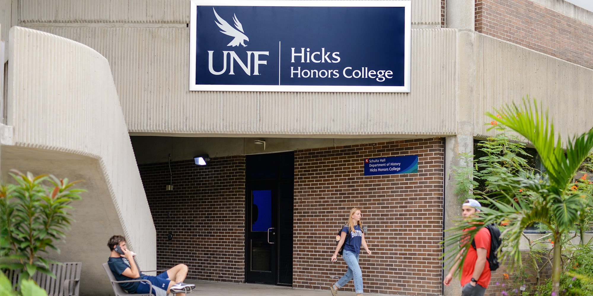 unf hicks honors college signage with students out front