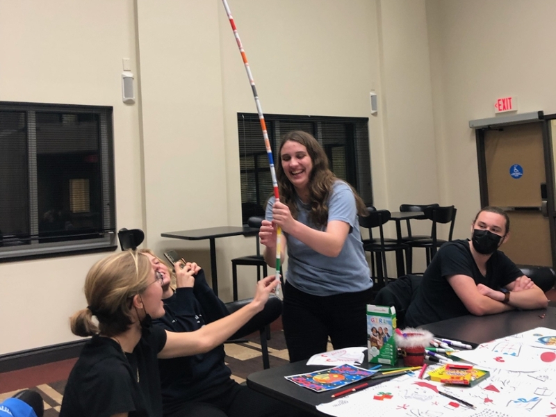 Global honors students build a sword made of markers