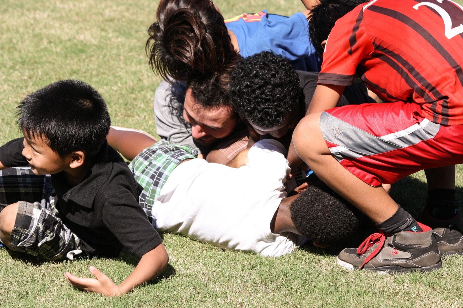 Soccer Breakout group playing with refugee children