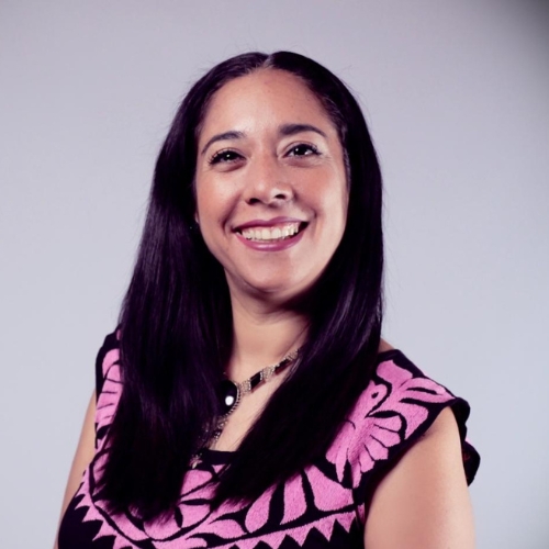 Andrea Gaytan Cuesta in front of a white backdrop