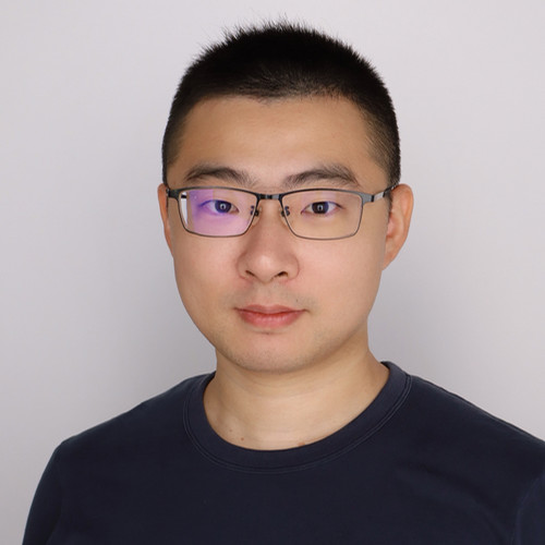 Yongzhao Wang in front of a white backdrop
