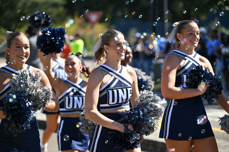 UNF Cheerleaders walking in the Homecoming parade