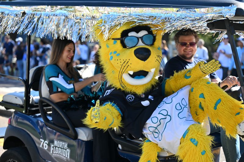 Jaxson De Ville, Jags Cheerleader and George Boston in the homecoming parade
