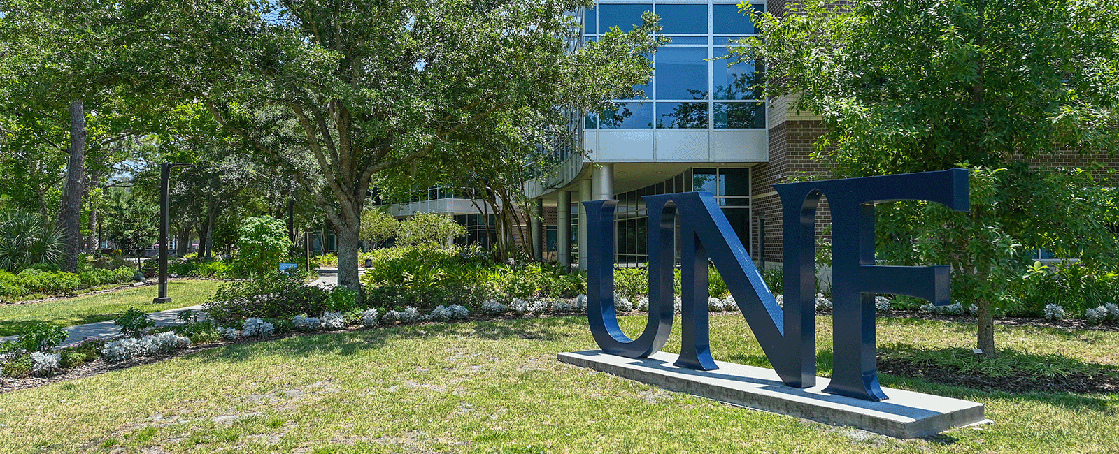 UNF Letters statue on a beautiful campus day