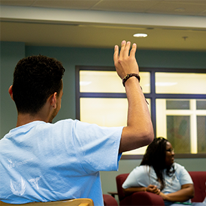 llc resident raising hand