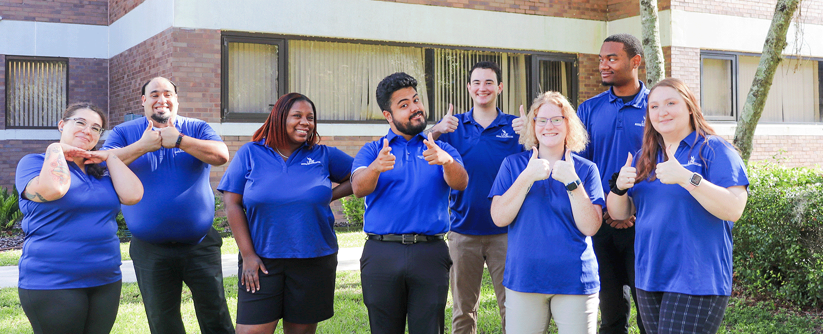 UNF residence Life coordinators smiling and having fun on a beautiful sunny day