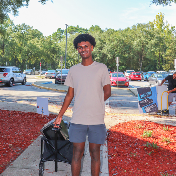 resident smiling moving into the residence hall