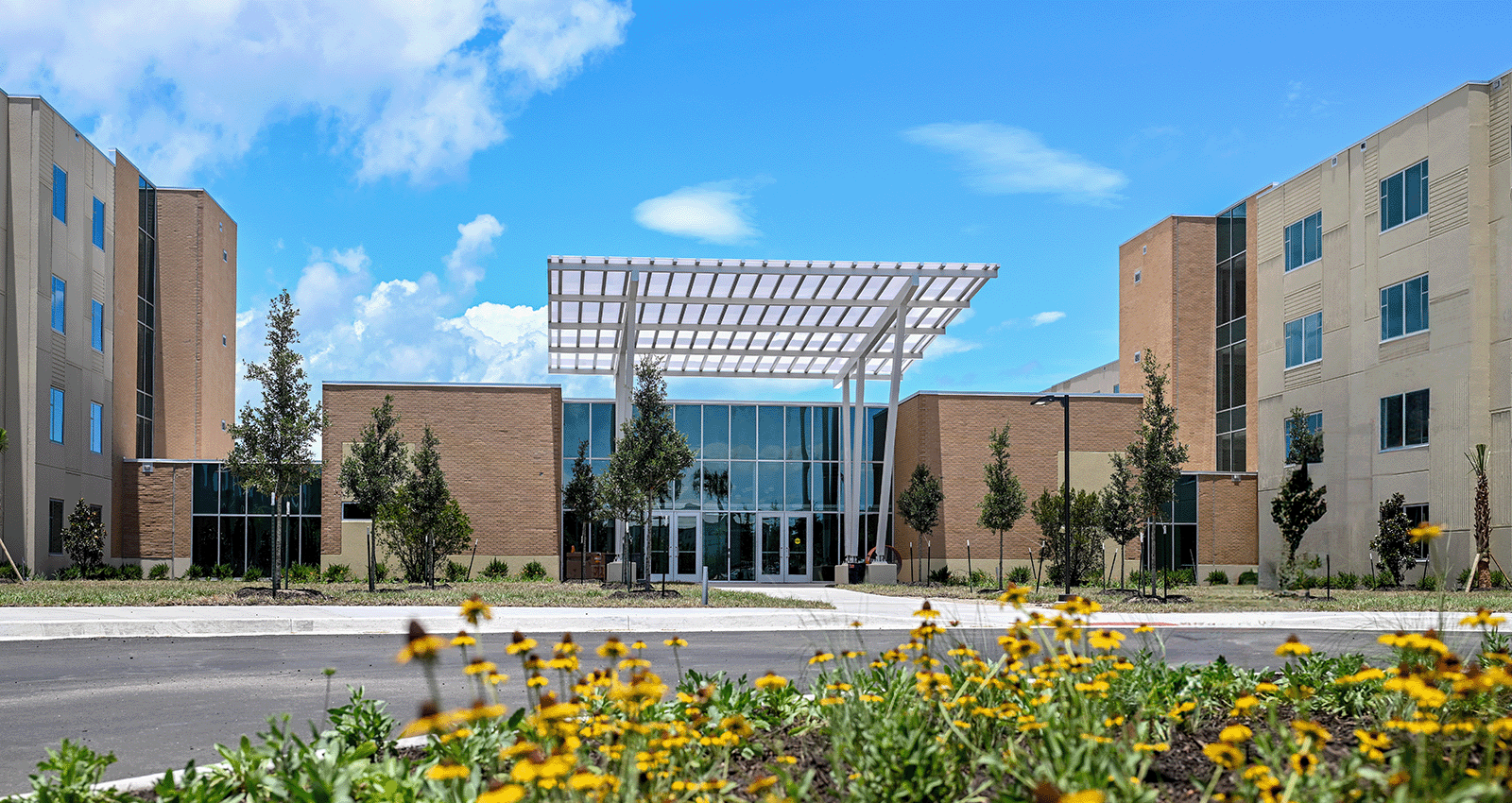 UNF Housing and Residence Life's newest residence hall Osprey Ridge on a gorgeous day