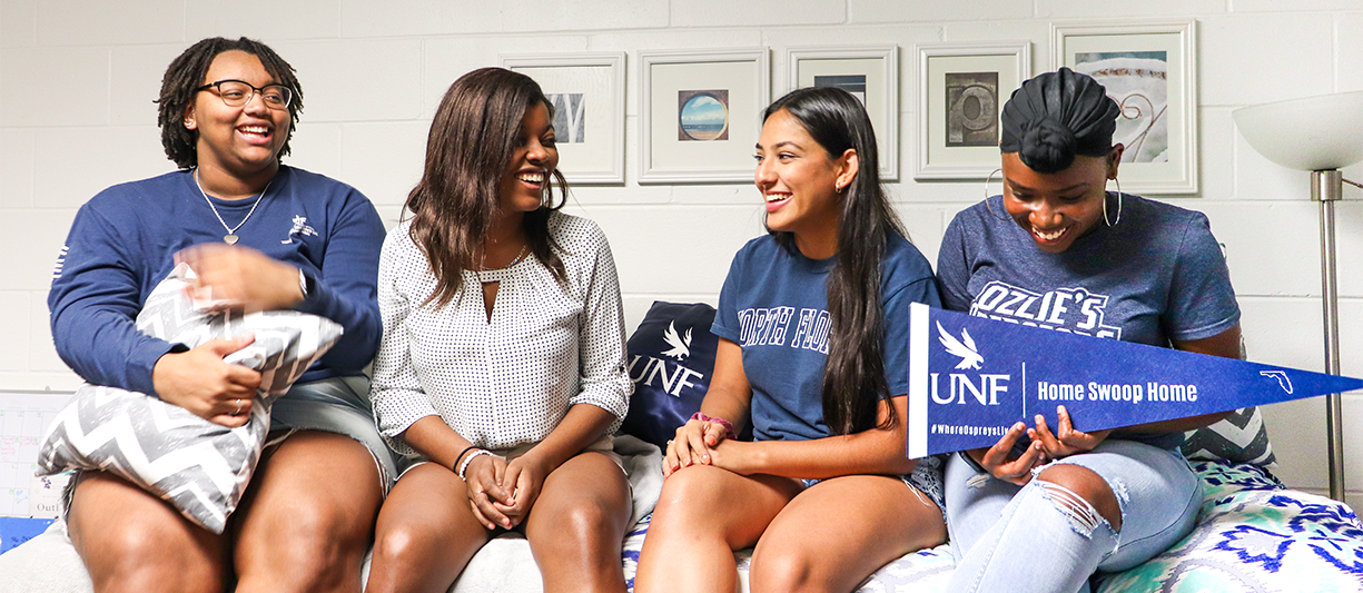 residents smiling in an osprey cove room