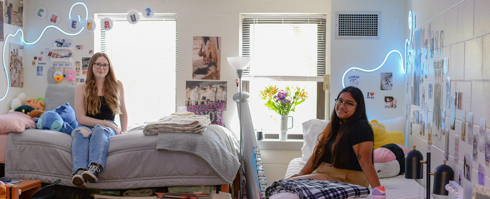 Two best dressed nest winners in their room smiling