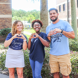 student staff members making hearts with hands