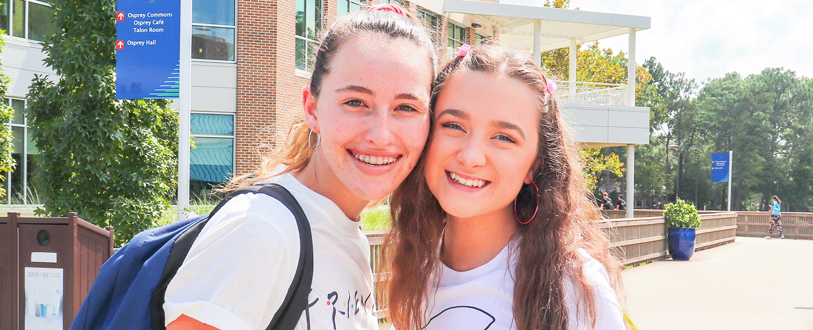 two residents smiling on a bright beautiful day