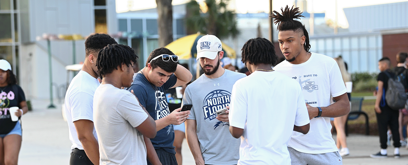 UNF students talking in a group on a beautiful day at UNF