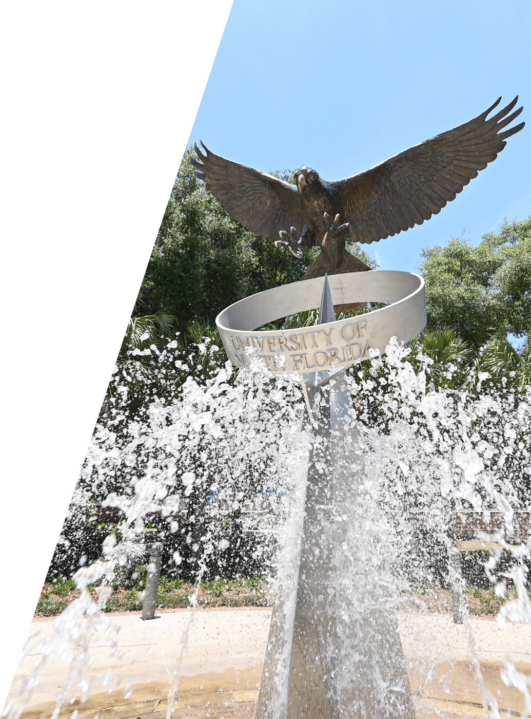 closeup of the osprey fountain statue with water spraying around it