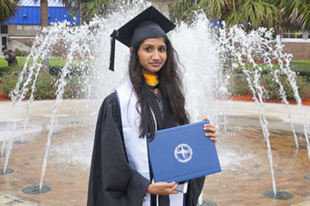 Student holding diploma