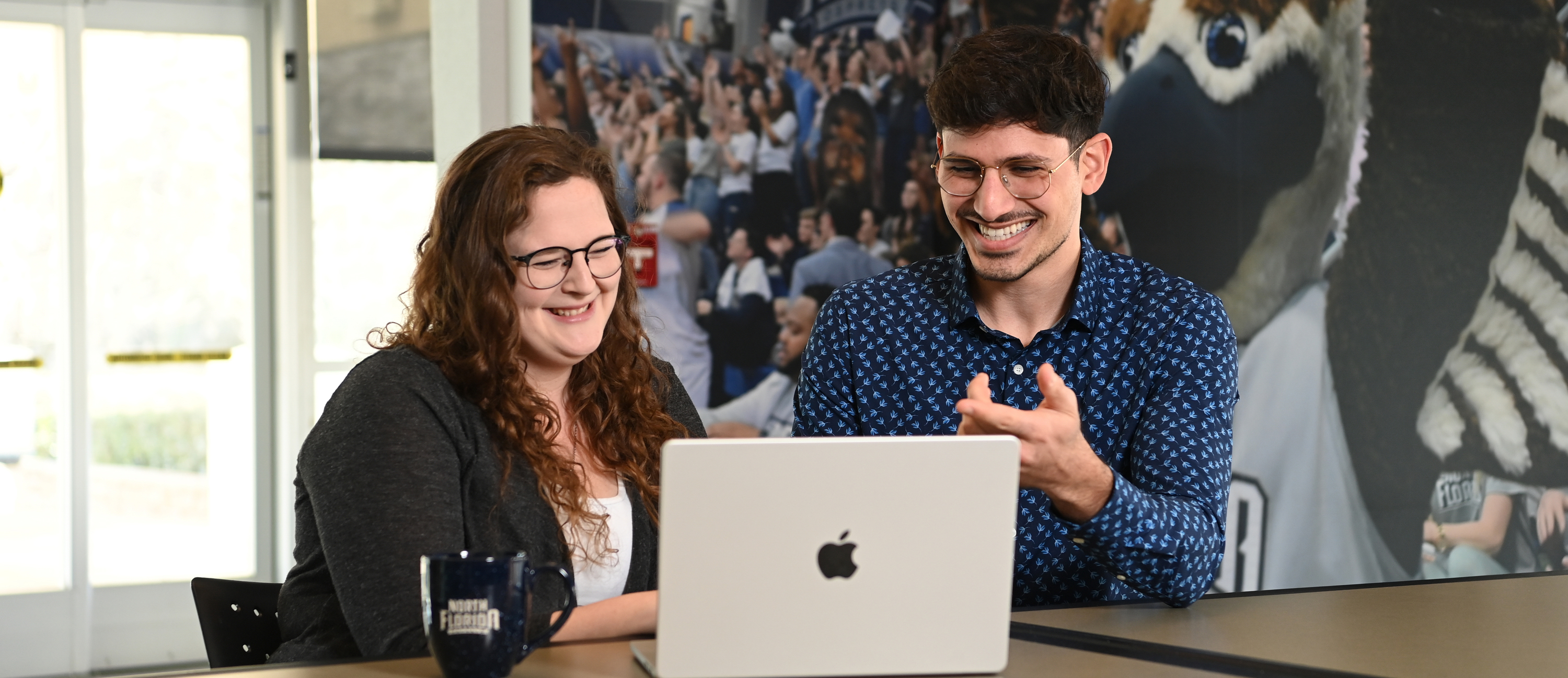Employees at Laptop smiling