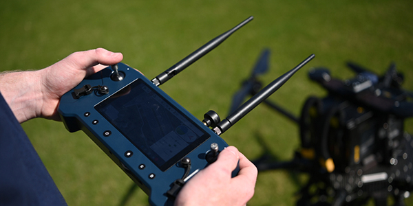 hands holding a drone controller