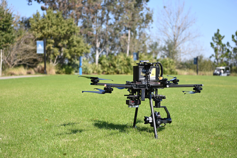 large drone on the ground with a camera attached
