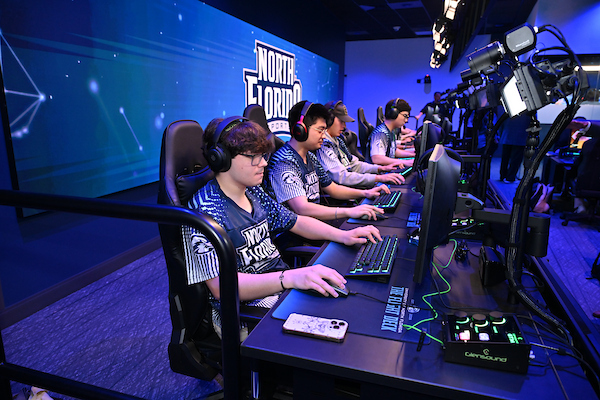 Esports players on competition stage