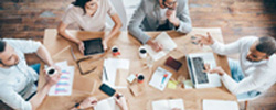 people consulting at a work table