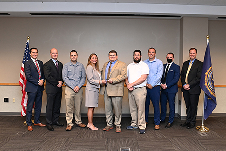 members of the unf its team getting an award from the fbi