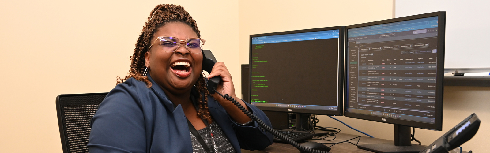 Student worker laughing on the phone