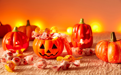 Festive image of pumpkin full of candy