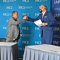 FSCJ President Avendano and Dr. Szymanski at a UNF MedNexus event