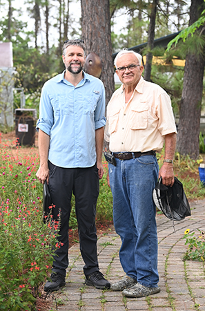 Kevin Anderson, left, with beekeeper George Sares