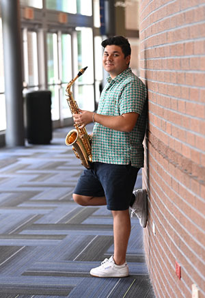 Gavin Martellotti holding a saxophone