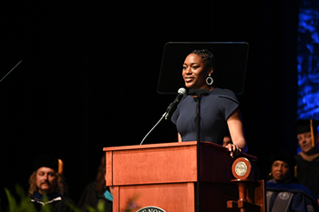 Mahalia White speaking at a podium during Inauguration